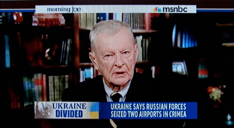 ORWELLIAN DOUBLETHINK: In his paternal ‘nation as person’ role, Zbigniew Brzezinski deploys his expert brain powers for a ‘noble cause’, while also slyly endorsing the permanent war economy.